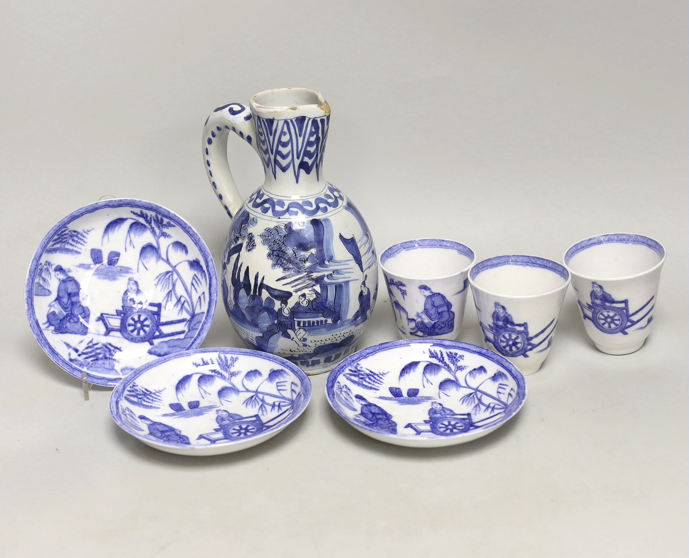 A late 17th century Delft blue and white ewer and three Chinese style tumblers and saucers, tallest 20cm